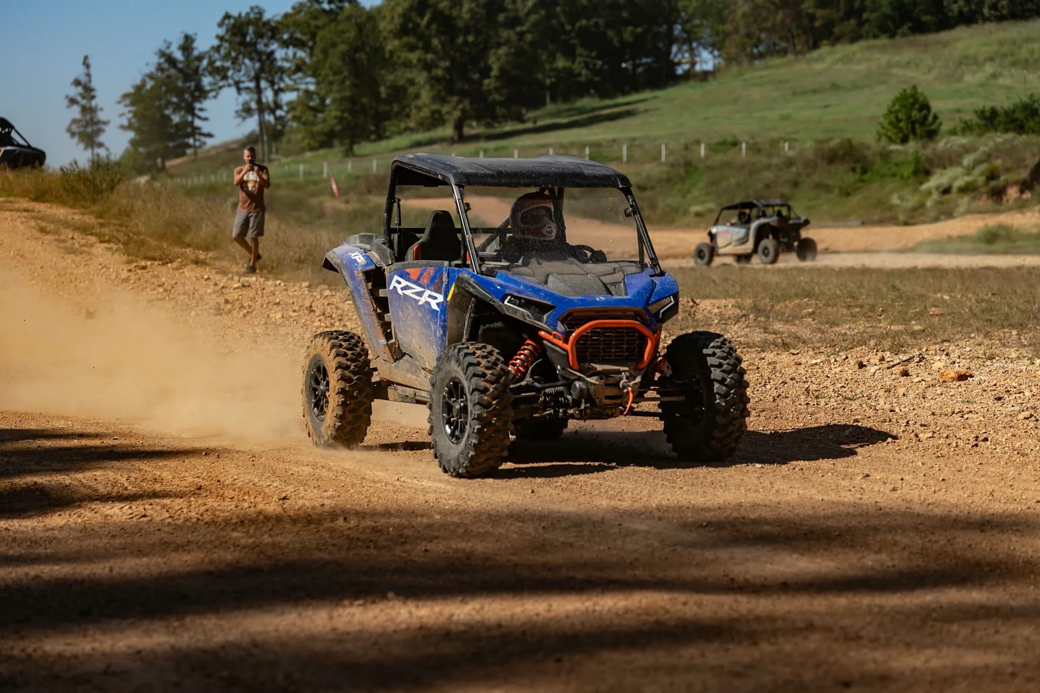 Blue Polaris RZR on the track